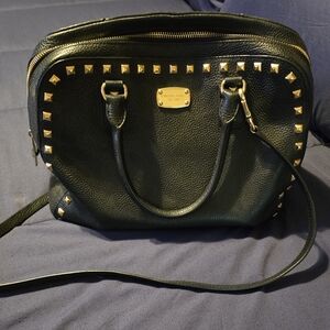Black and gold studded purse